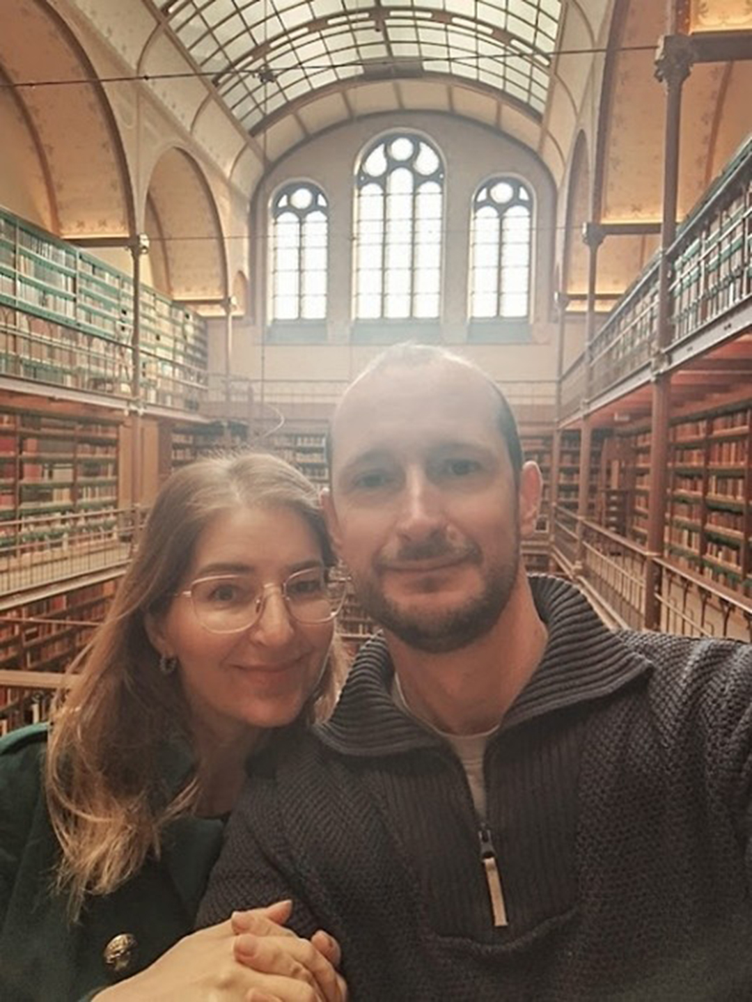 Visitors posing in the famous Rijksmuseum library in Amsterdam.