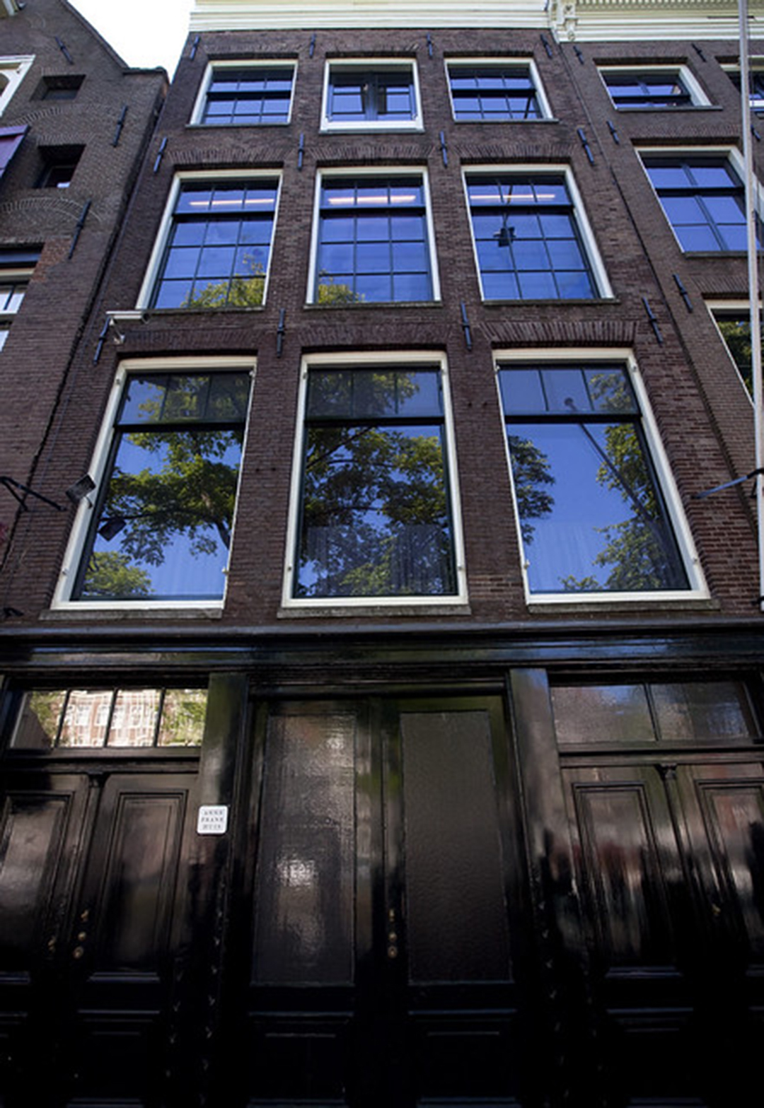 Facade of the Anne Frank House along the Prinsengracht canal in Amsterdam.