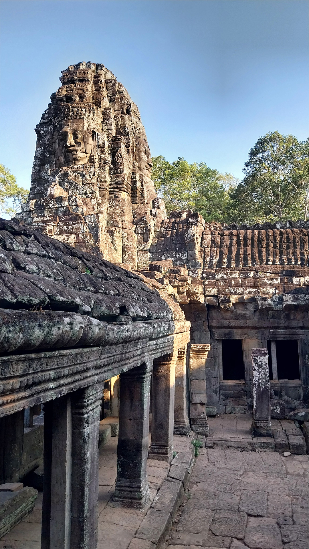Close-up of a stone face at Bayon Temple, one of the most recognizable symbols of the Khmer civilization.